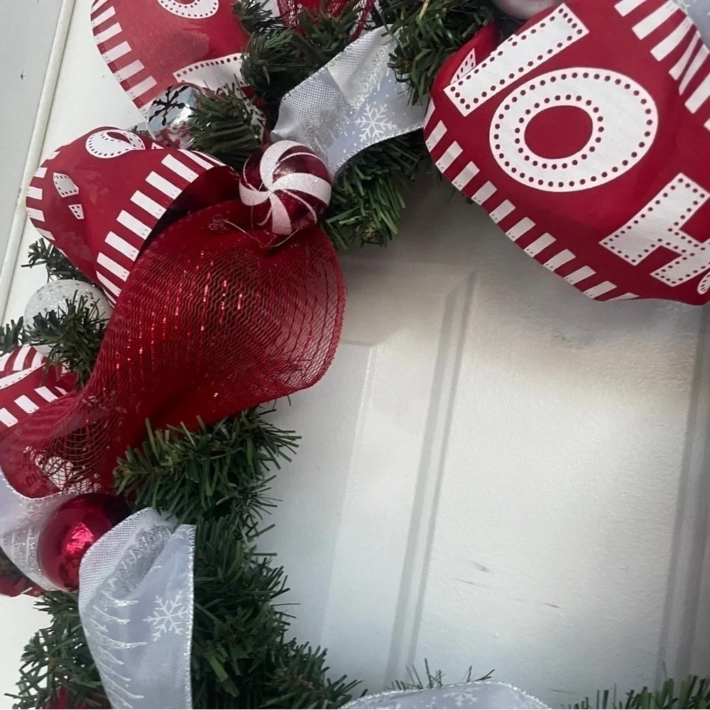 Handmade Christmas wreath, ribbon,bells, and ornaments. Silver, white and red